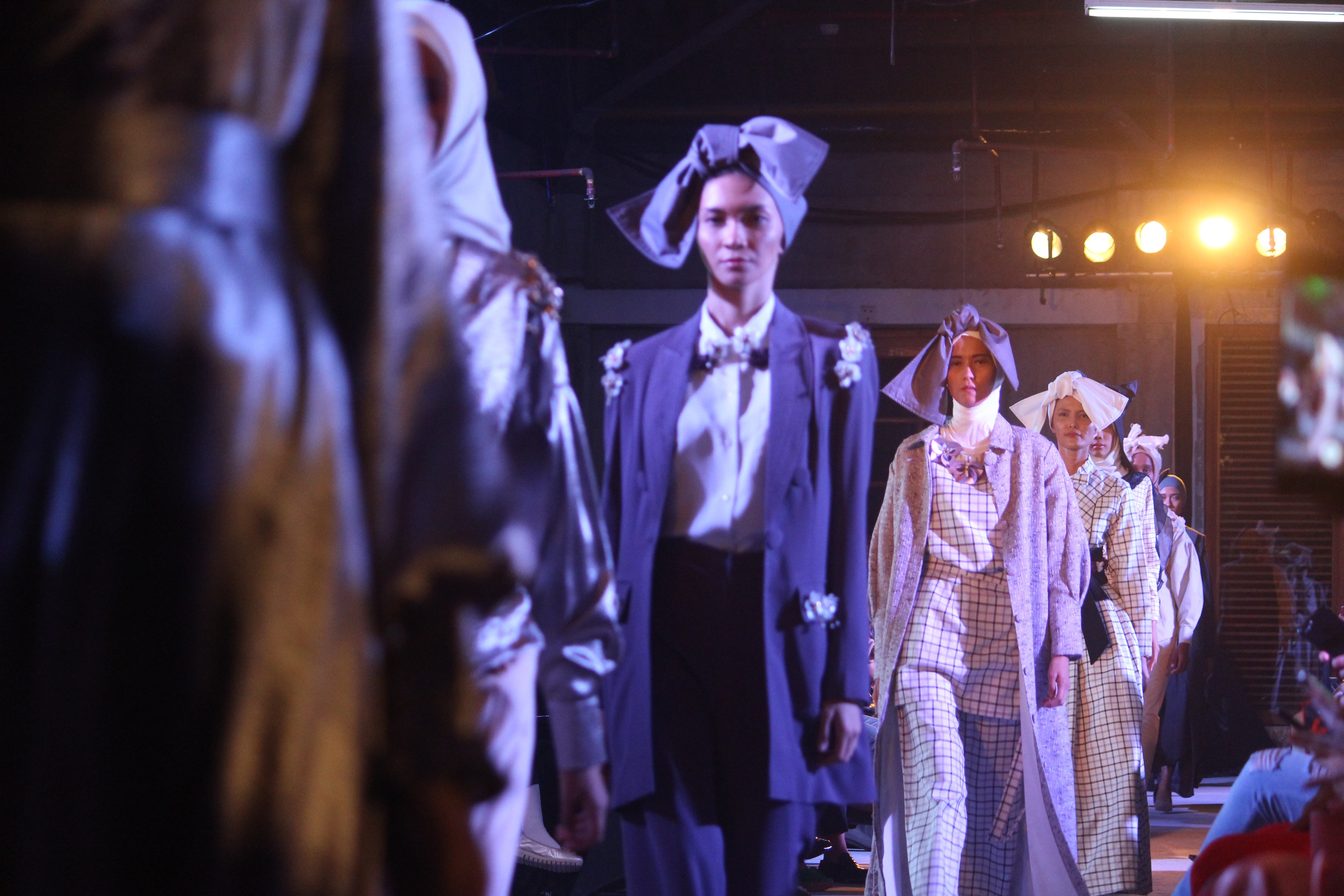 Models showcasing avant-garde designs on the runway during Copenhagen Fashion Week, a premier event in Scandinavia's fashion capital.